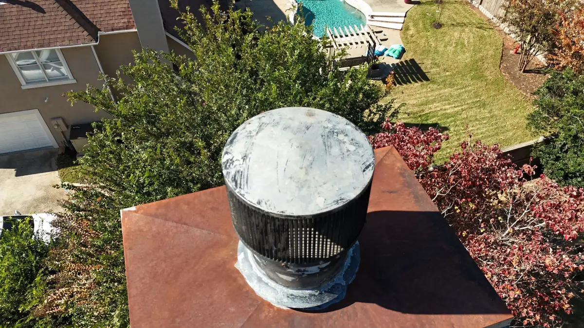 Close view of rooftop metal vent flashing surrounded by roofing shingles, Southern Premier Roofing work near Buford GA
