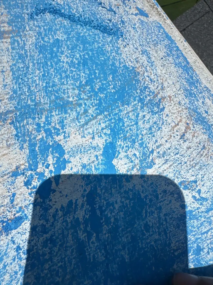 Close view of heavily weathered blue coated roof membrane, Southern Premier Roofing work near Carl GA