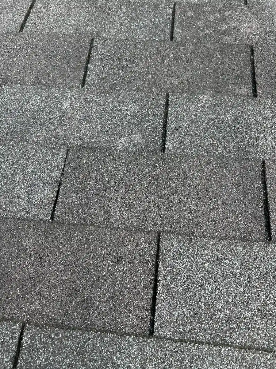 Close view shows separated and uneven asphalt shingle seams, Southern Premier Roofing work near Colbert GA
