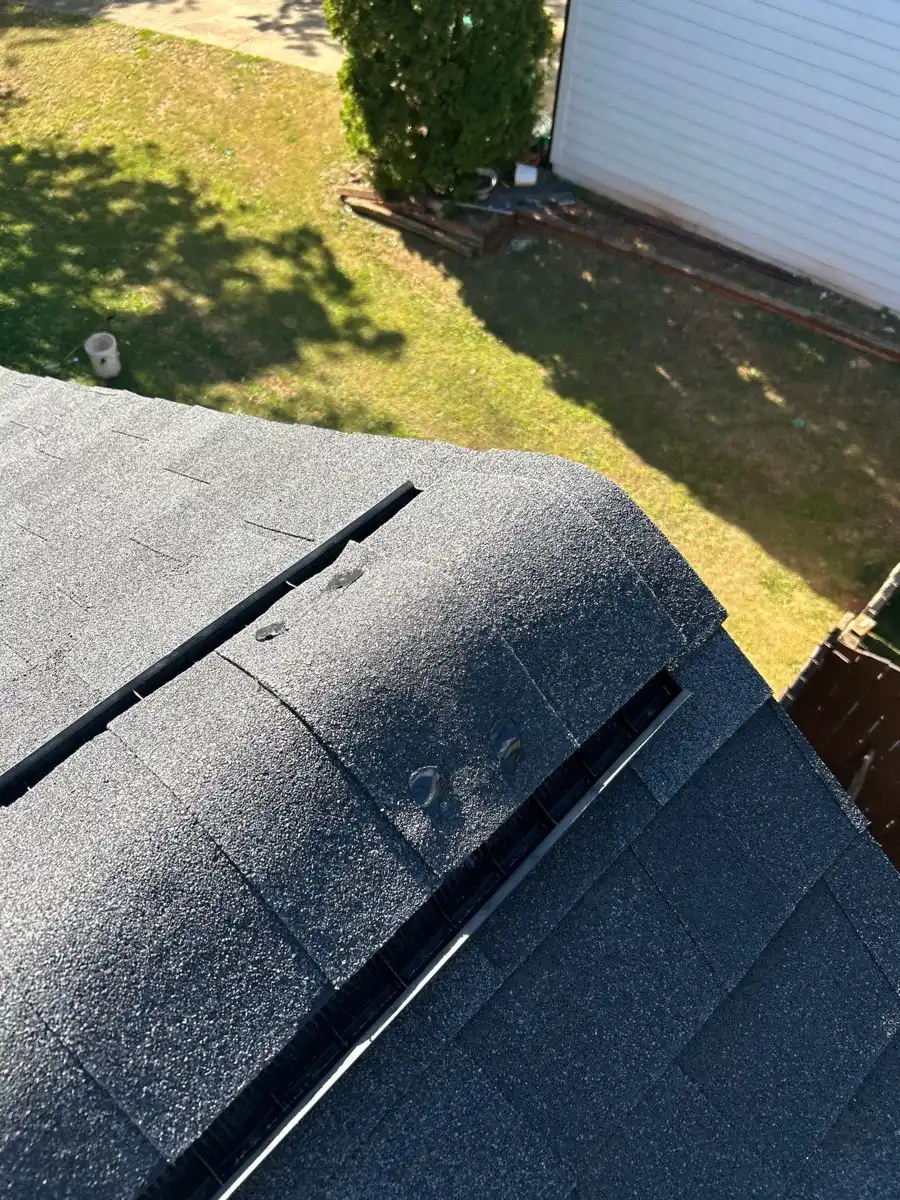 Close view of ridge vent installed along shingle roof peak, Southern Premier Roofing work near Commerce GA