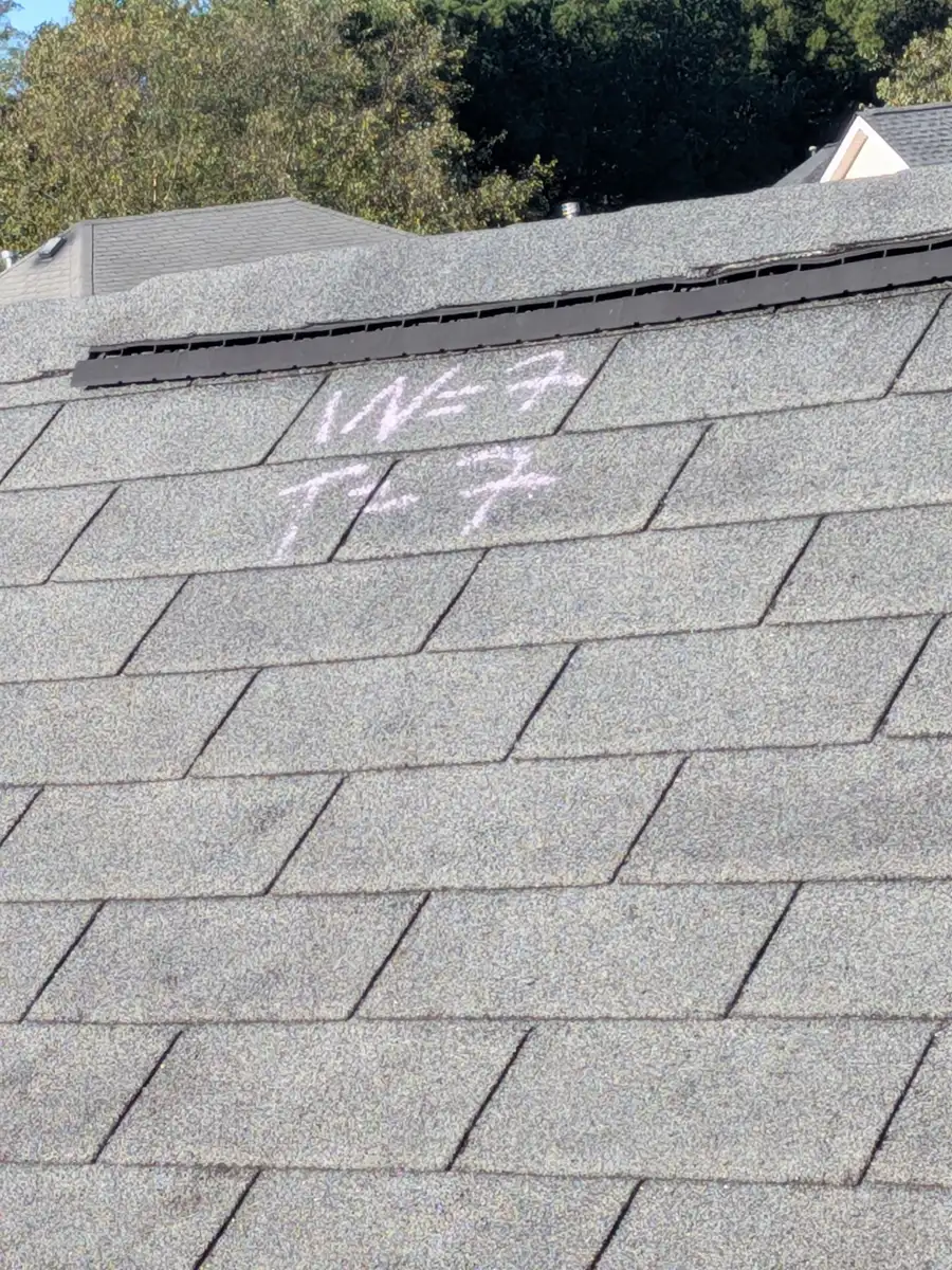 Shingle roof section with chalk markings near upper roof edge, Southern Premier Roofing work near Dacula GA