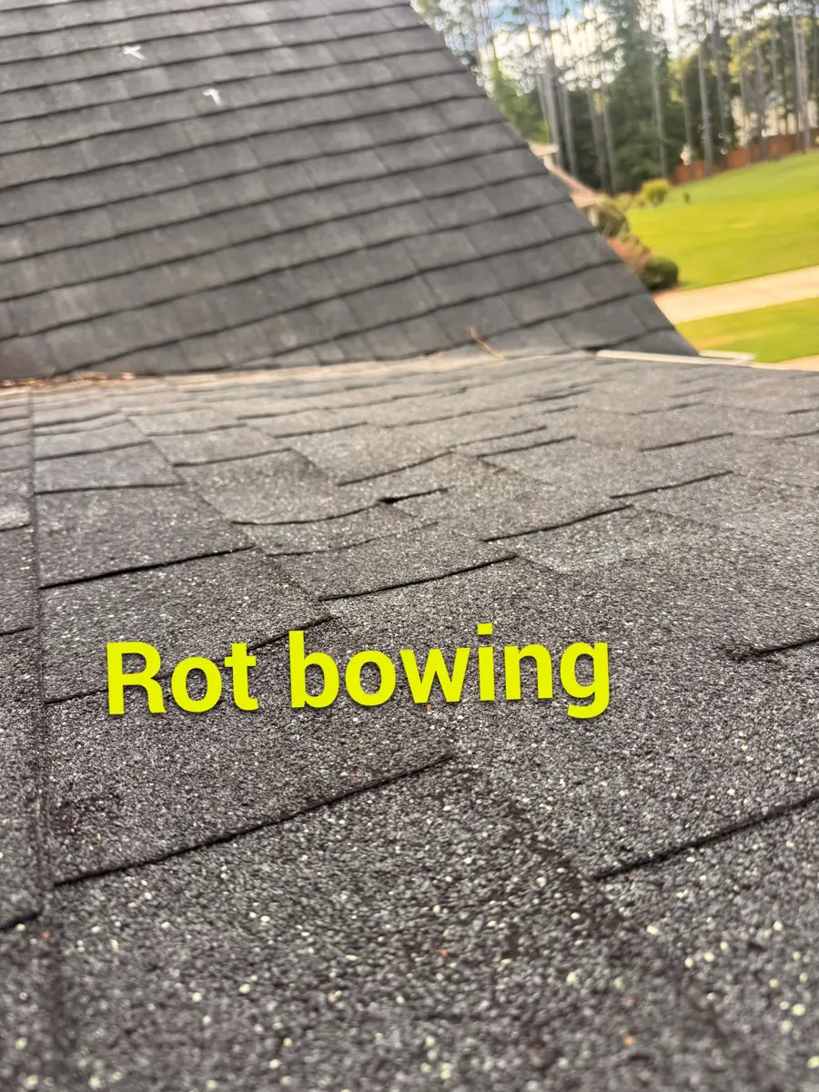 Roof valley visibly sags with labeled rot damage on shingles, Southern Premier Roofing work near Hull GA