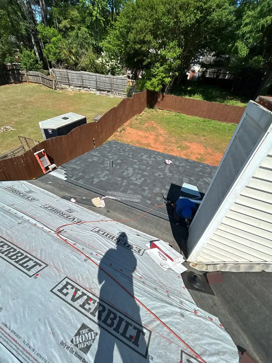 Roof underlayment installed beside finished shingle section, Southern Premier Roofing work near Hull GA