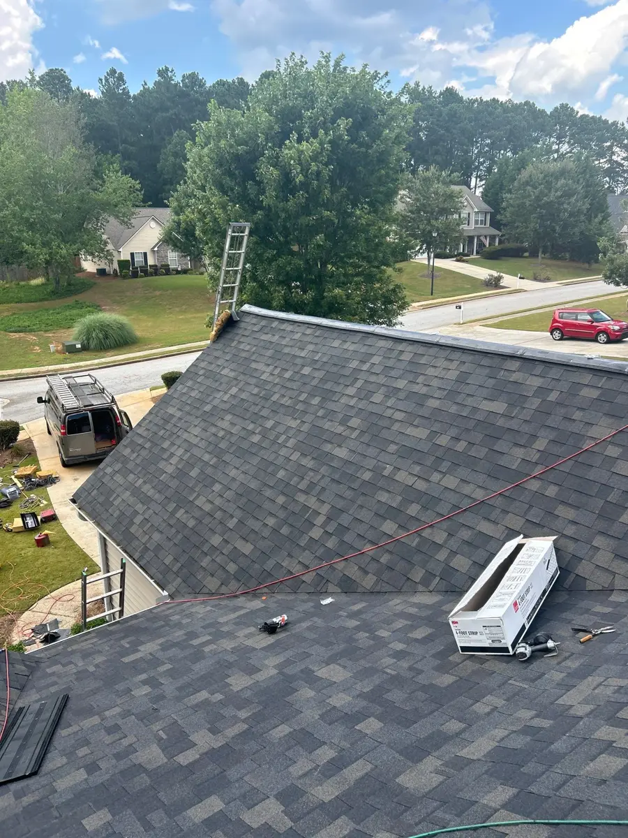 Completed shingle roof viewed from above with rooftop vent installed, Southern Premier Roofing work near Jefferson GA