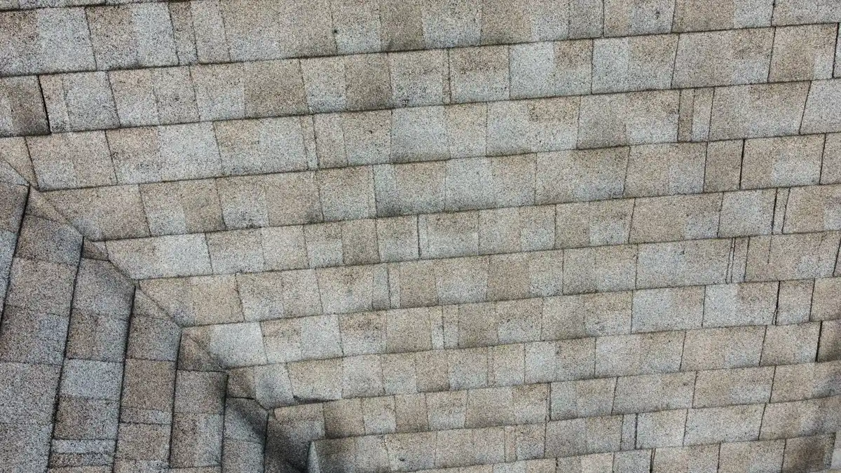 Close view of aging architectural shingles across roof valley, Southern Premier Roofing work near Jersey GA
