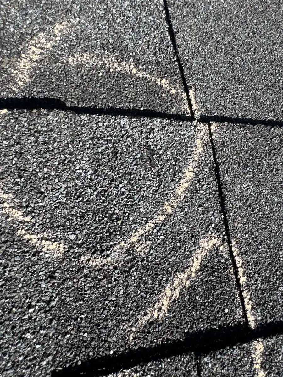 Close view of granule loss and damaged shingle seams, Southern Premier Roofing work near Mulberry GA