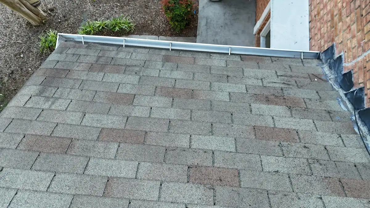 Low roof section covered with evenly installed weathered shingles, Southern Premier Roofing work near Norcross GA