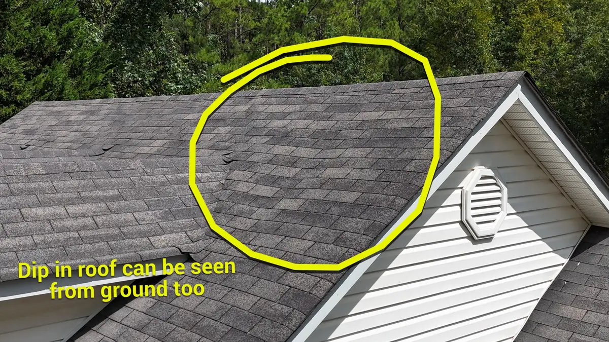 Roof shingles show a visible dip along the roof slope, Southern Premier Roofing work near Peachtree Corners GA