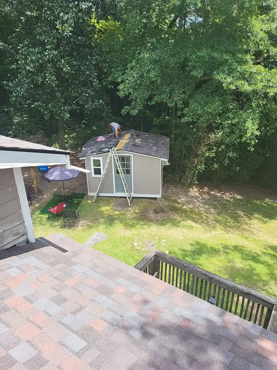 Finished shingle roof overlooking backyard shed and deck, Southern Premier Roofing work near Peachtree Corners GA