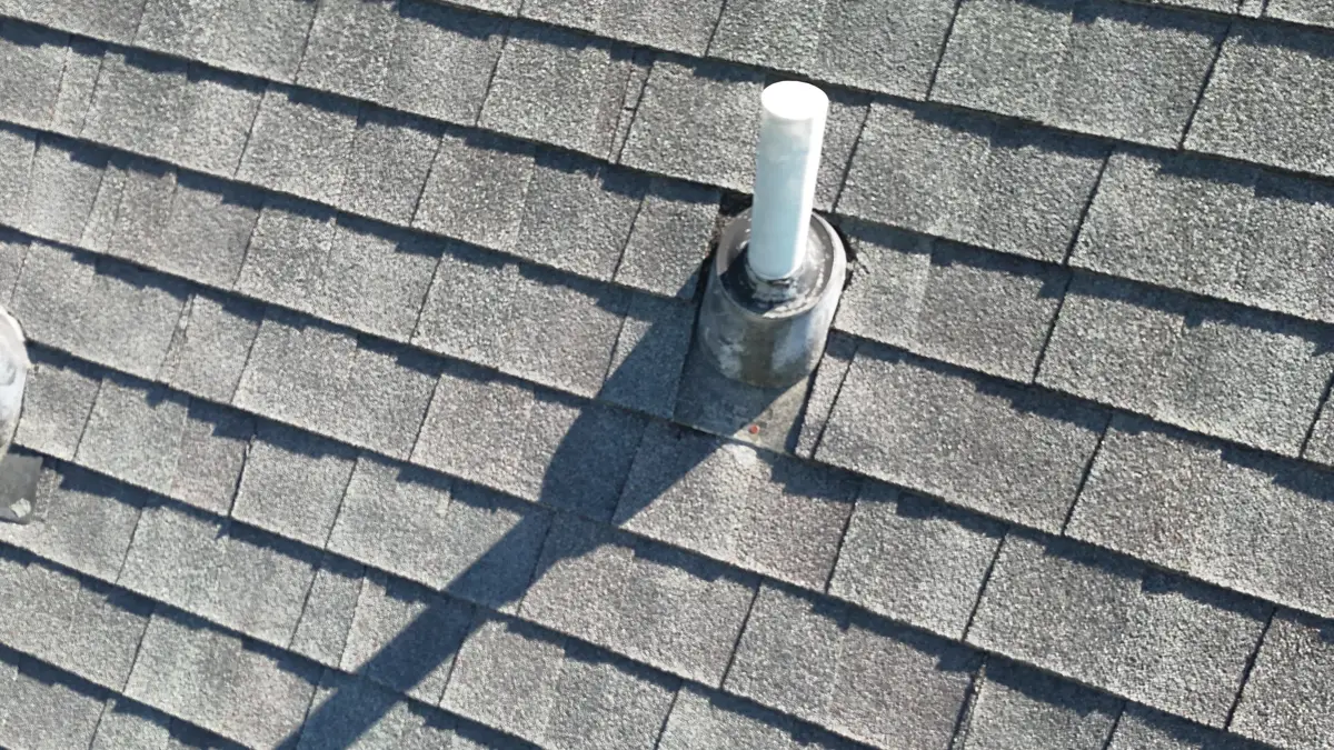 Metal vent pipe flashing installed across weathered roof shingles, Southern Premier Roofing work near Pendergrass GA