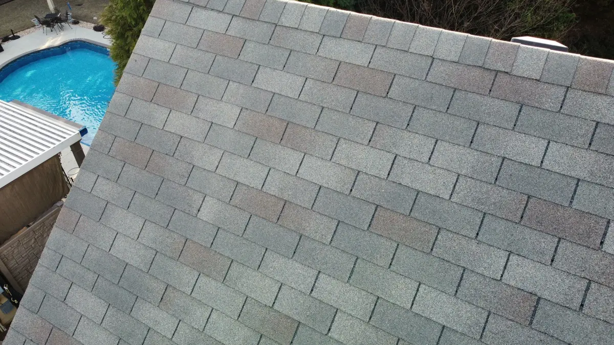 Clean gray shingle roof viewed from above beside a pool, Southern Premier Roofing work near Pendergrass GA
