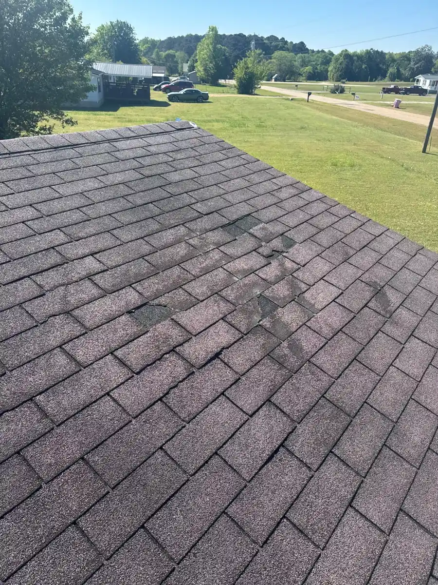 Roof surface shows clustered dark staining and worn shingle areas, Southern Premier Roofing work near Rutledge GA