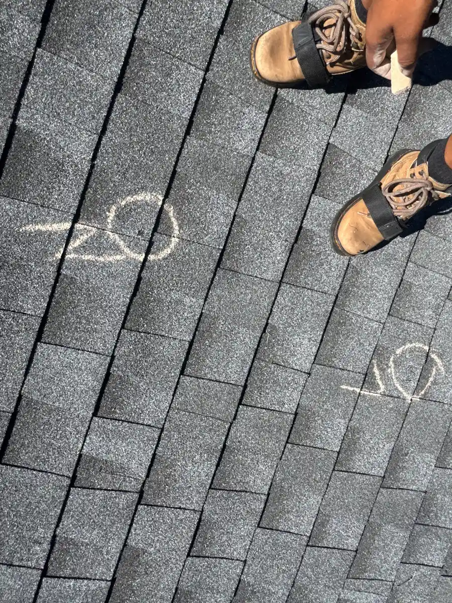 Roof shingles marked around several areas of visible wear, Southern Premier Roofing work near Snellville GA