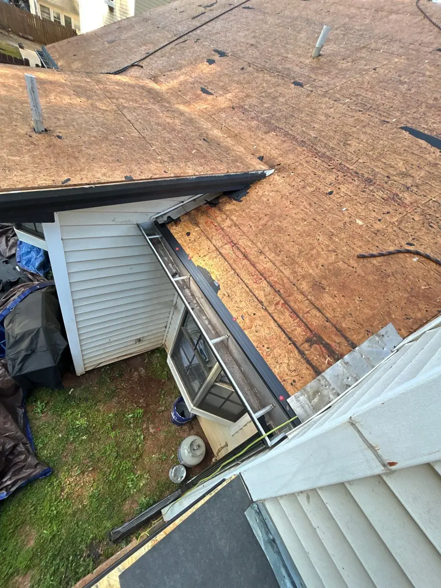 Exposed roof decking surrounding dormer and lower roof section, Southern Premier Roofing work near Stone Mountain GA