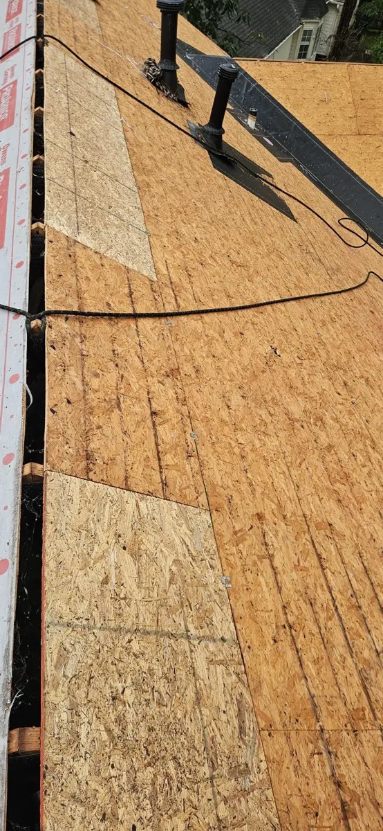 Roof deck exposed with plywood sheathing and installed flashing, Southern Premier Roofing work near Sugar Hill GA