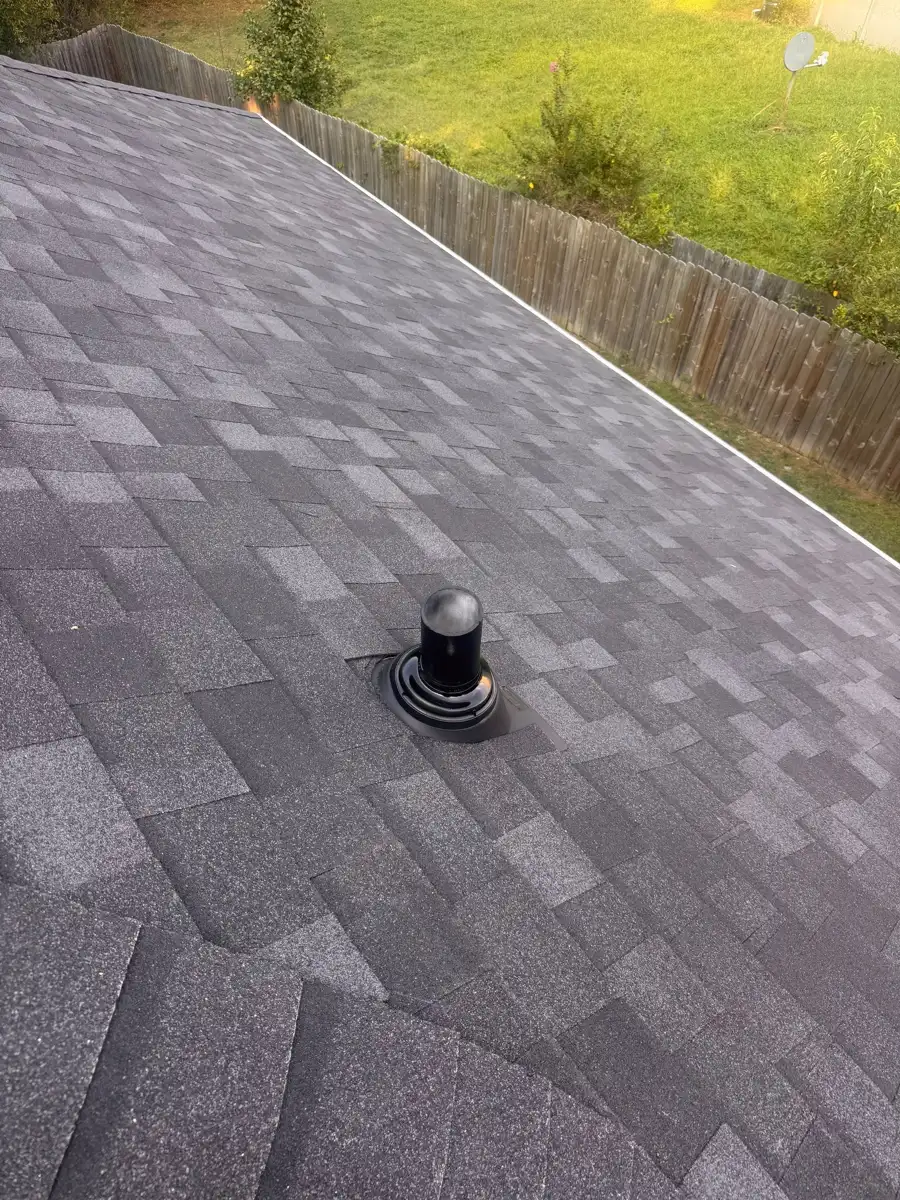 Roof shingles surrounding a newly installed round vent, Southern Premier Roofing work near Suwanee GA