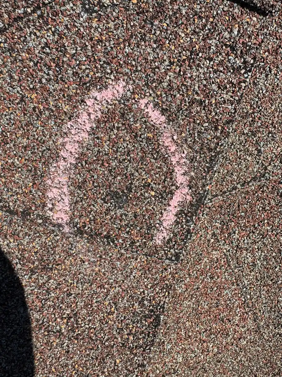 Roof shingles show a pink outlined mark across their surface, Southern Premier Roofing work near Talmo GA