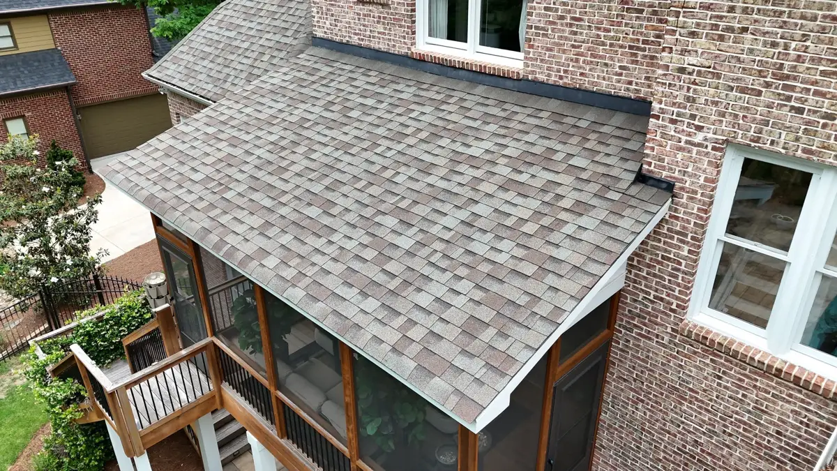 Completed shingle roof covering a brick-sided home addition, Southern Premier Roofing work near Winterville GA