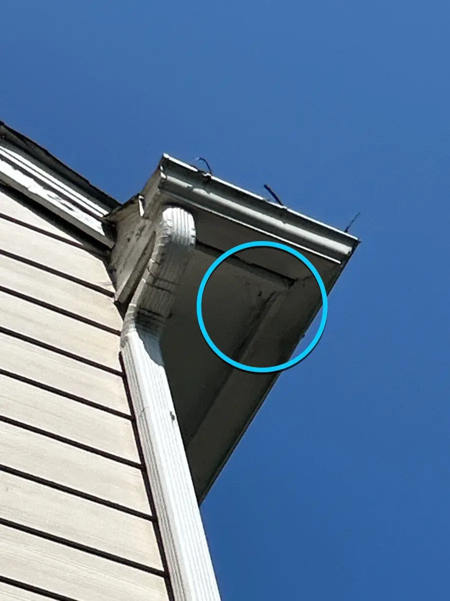 Closeup of damaged soffit area beneath roof edge, Southern Premier Roofing work near Hoschton GA