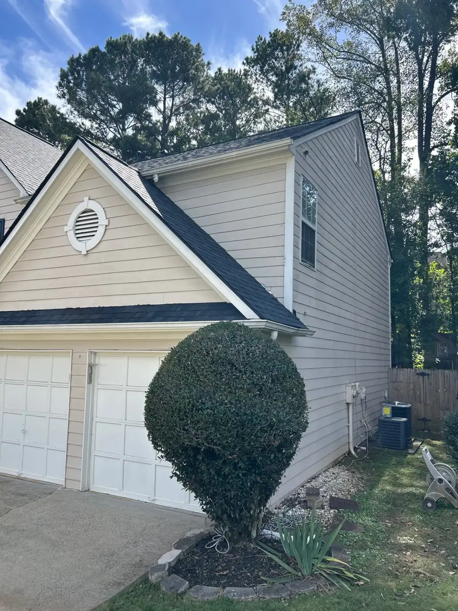 Completed gray roof and siding viewed from front yard, Southern Premier Roofing work near Walnut Grove GA