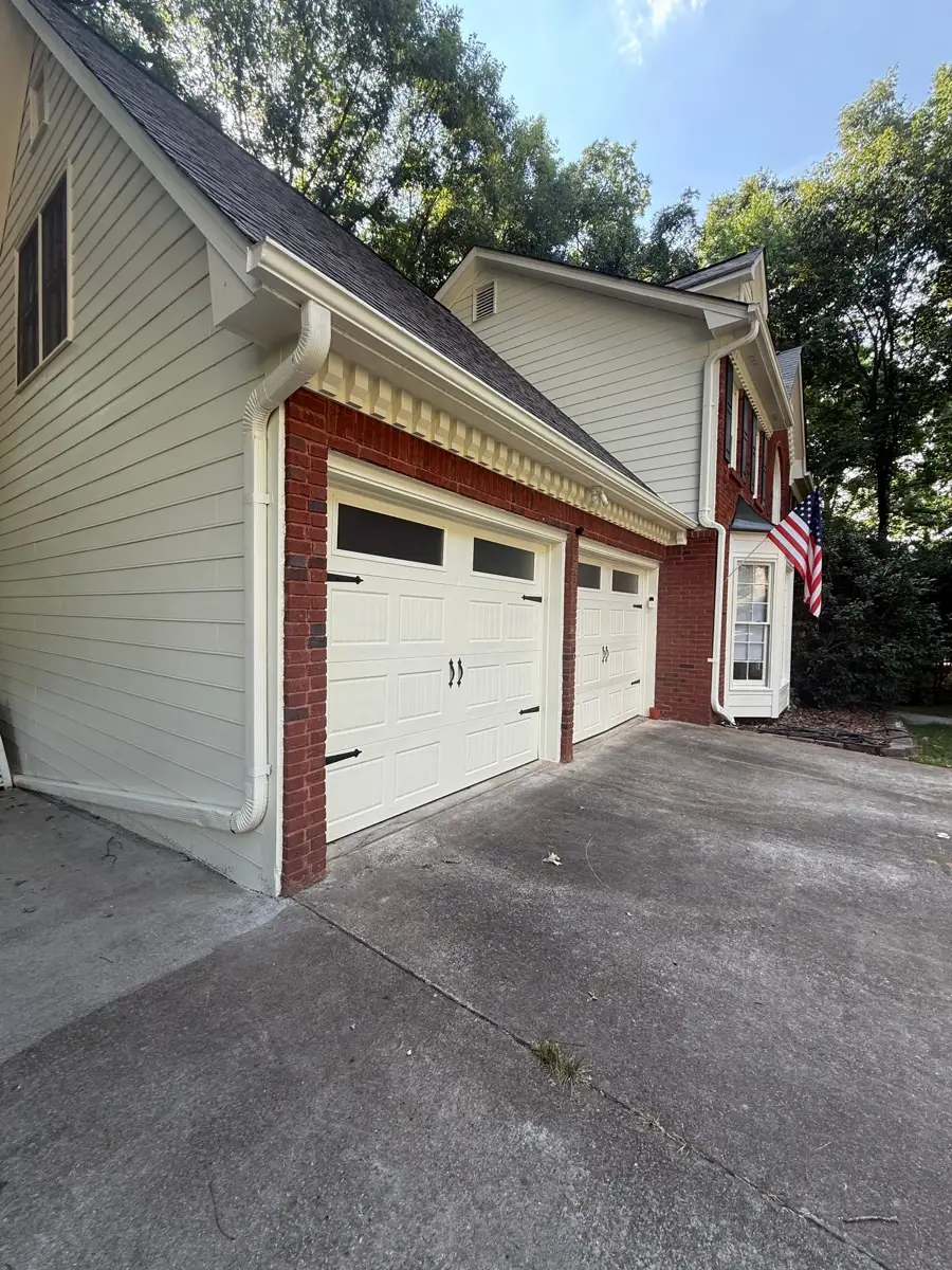 Finished garage roof and exterior siding viewed from driveway, Southern Premier Roofing work near Braselton GA