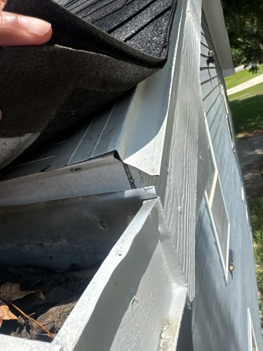 Close view of roof edge flashing beside gutter and siding, Southern Premier Roofing work near Statham GA