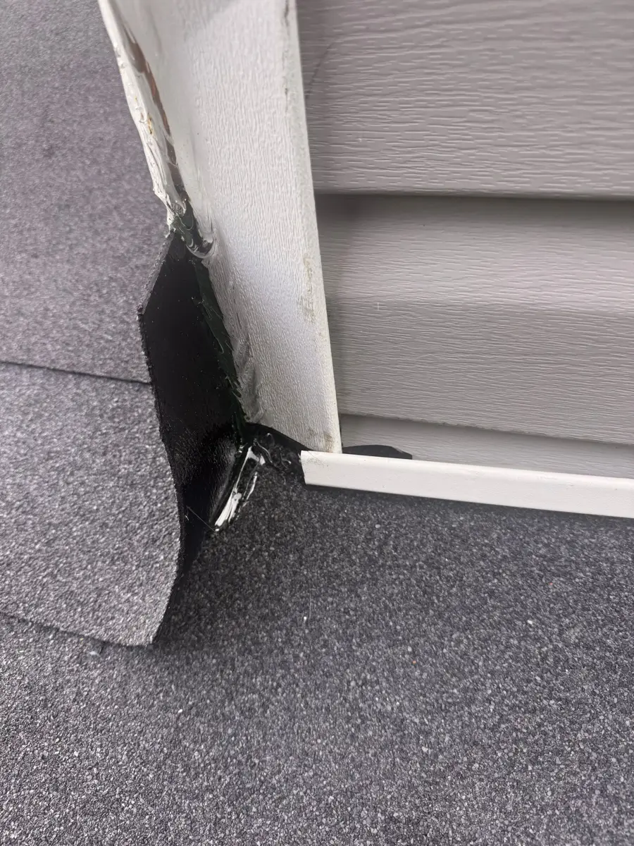 Close view of roof edge flashing beside exterior siding, Southern Premier Roofing work near Carl GA