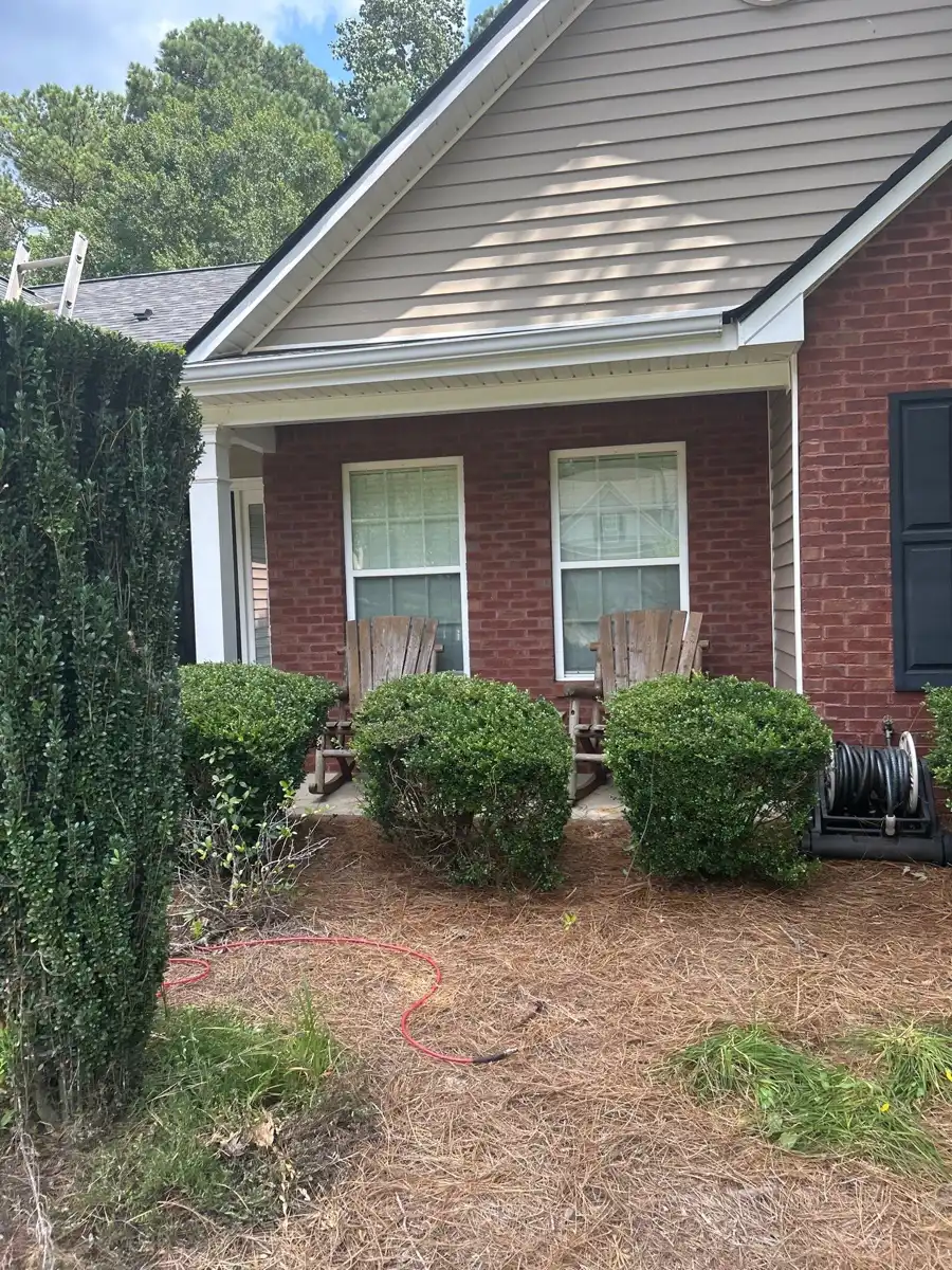 Completed gable roof with shingles above brick and siding, Southern Premier Roofing work near Carl GA